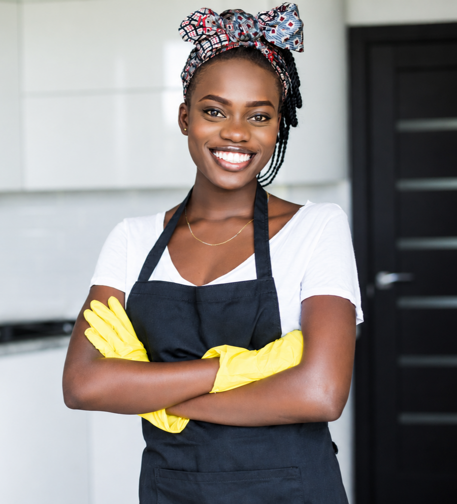 Smiling domestic worker ready to help with household cleaning