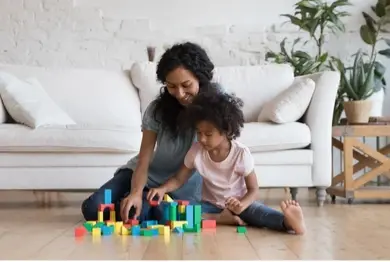 Nanny playing with a young child